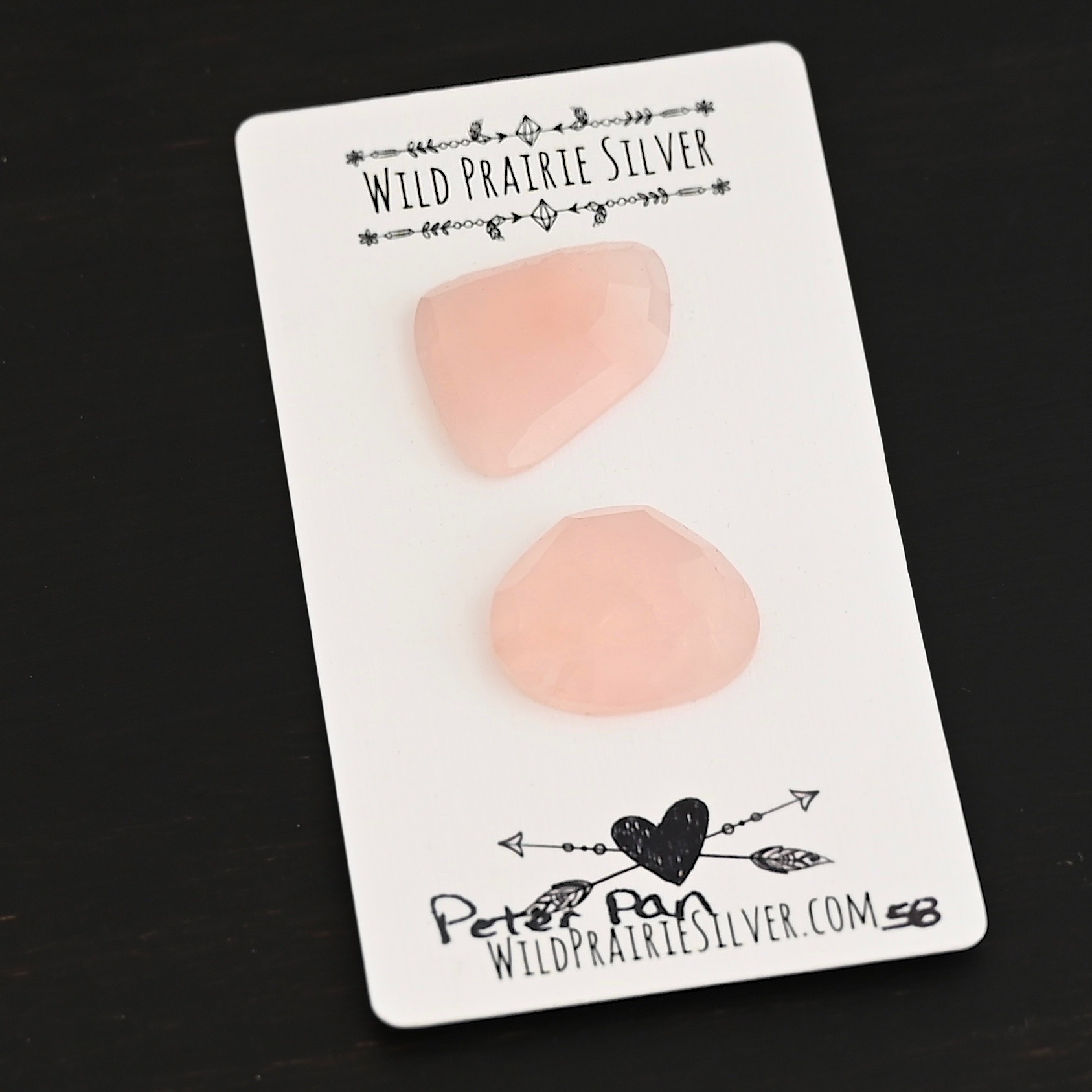 Peter Pan Rose Cut Rose Quartz Cabochon Parcel shown on business card
