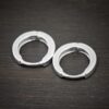 sterling silver Winona Huggie Hoop Earrings - shiny shown on dark background