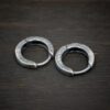 sterling silver Winona Huggie Hoop Earrings - oxidized shown on dark background