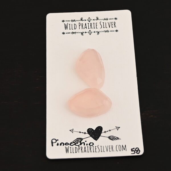 Pinocchio Rose Cut Rose Quartz Cabochon Parcel shown on business card