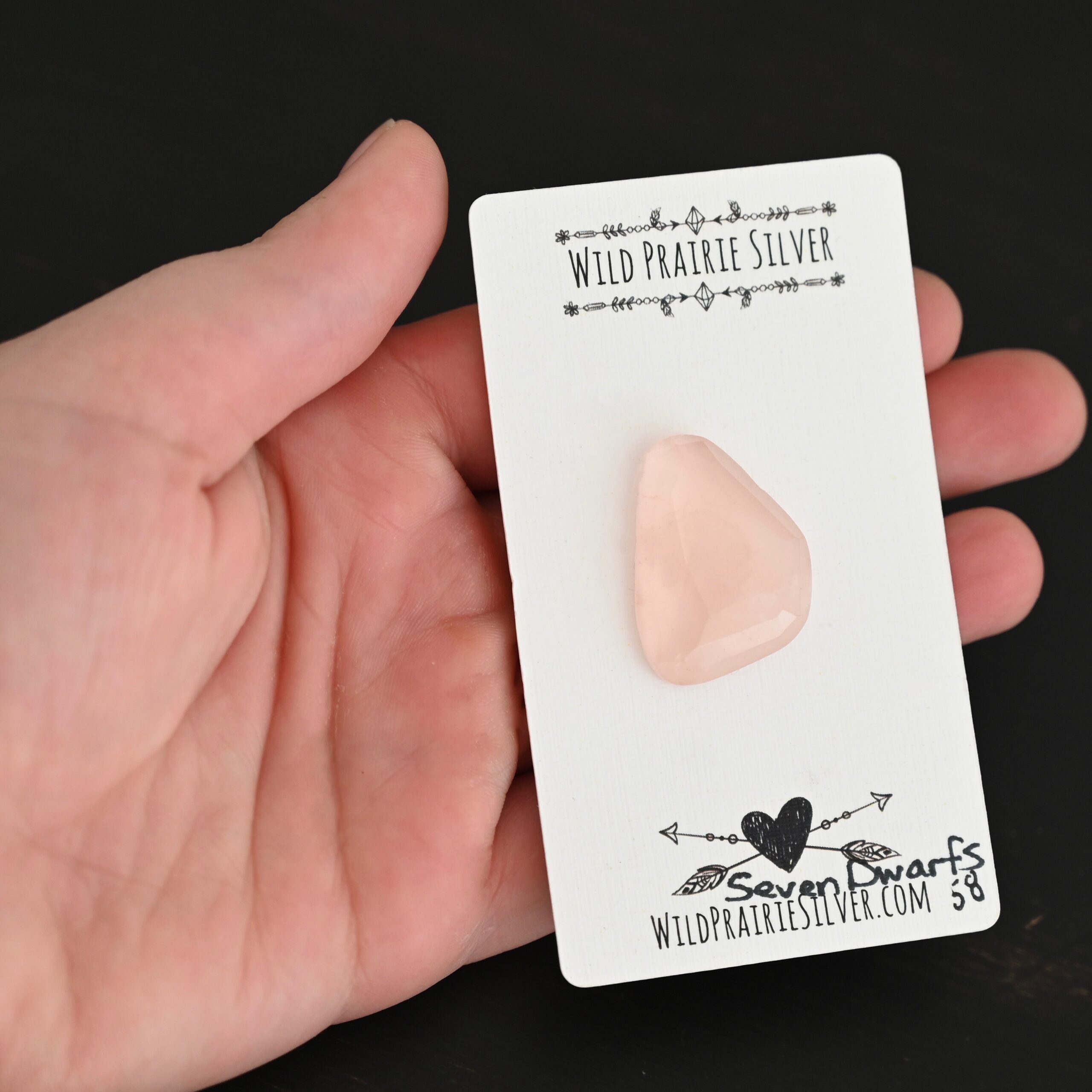 Seven Dwarfs Rose Cut Rose Quartz Cabochon Parcel shown in hand