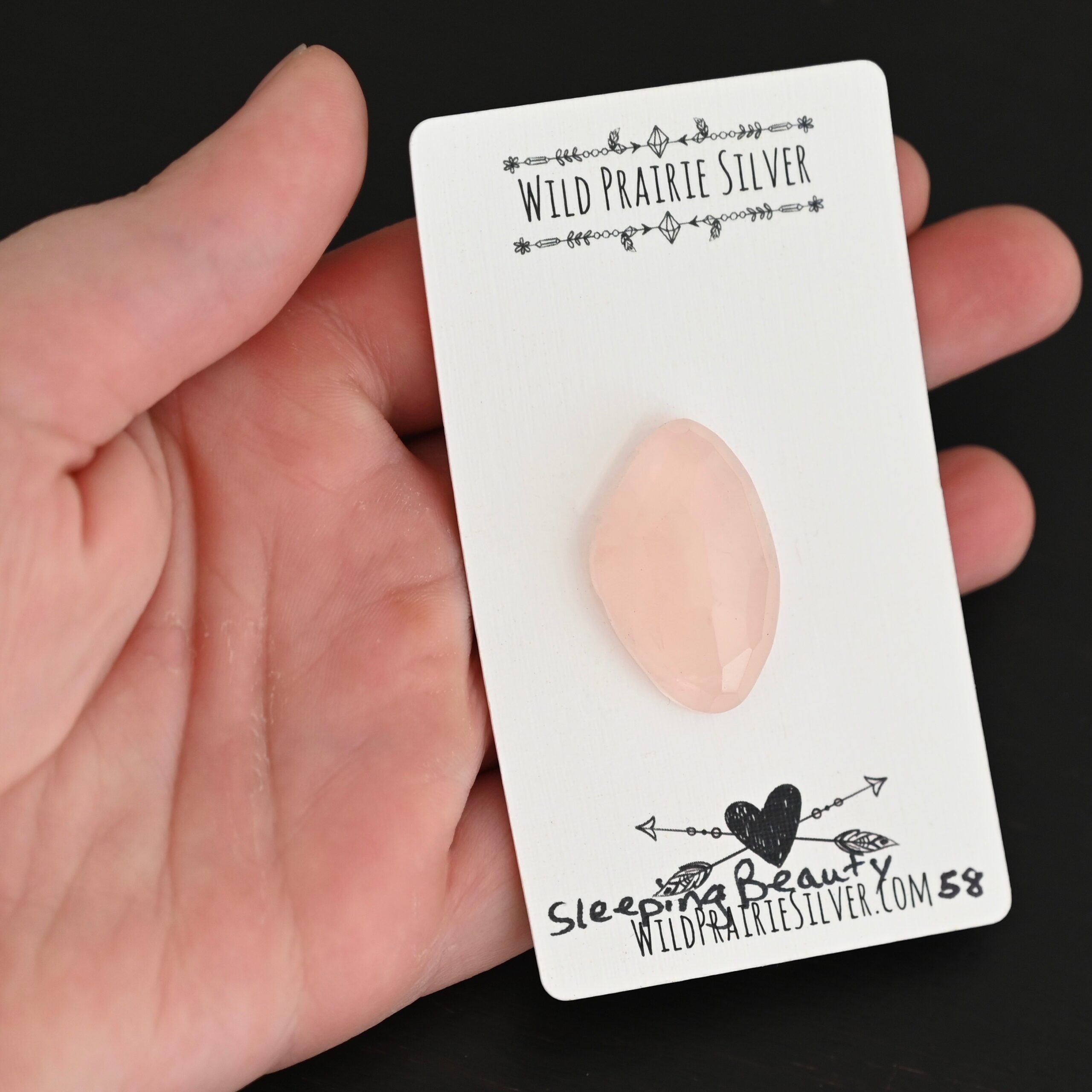 Sleeping Beauty Rose Cut Rose Quartz Cabochon Parcel shown in hand