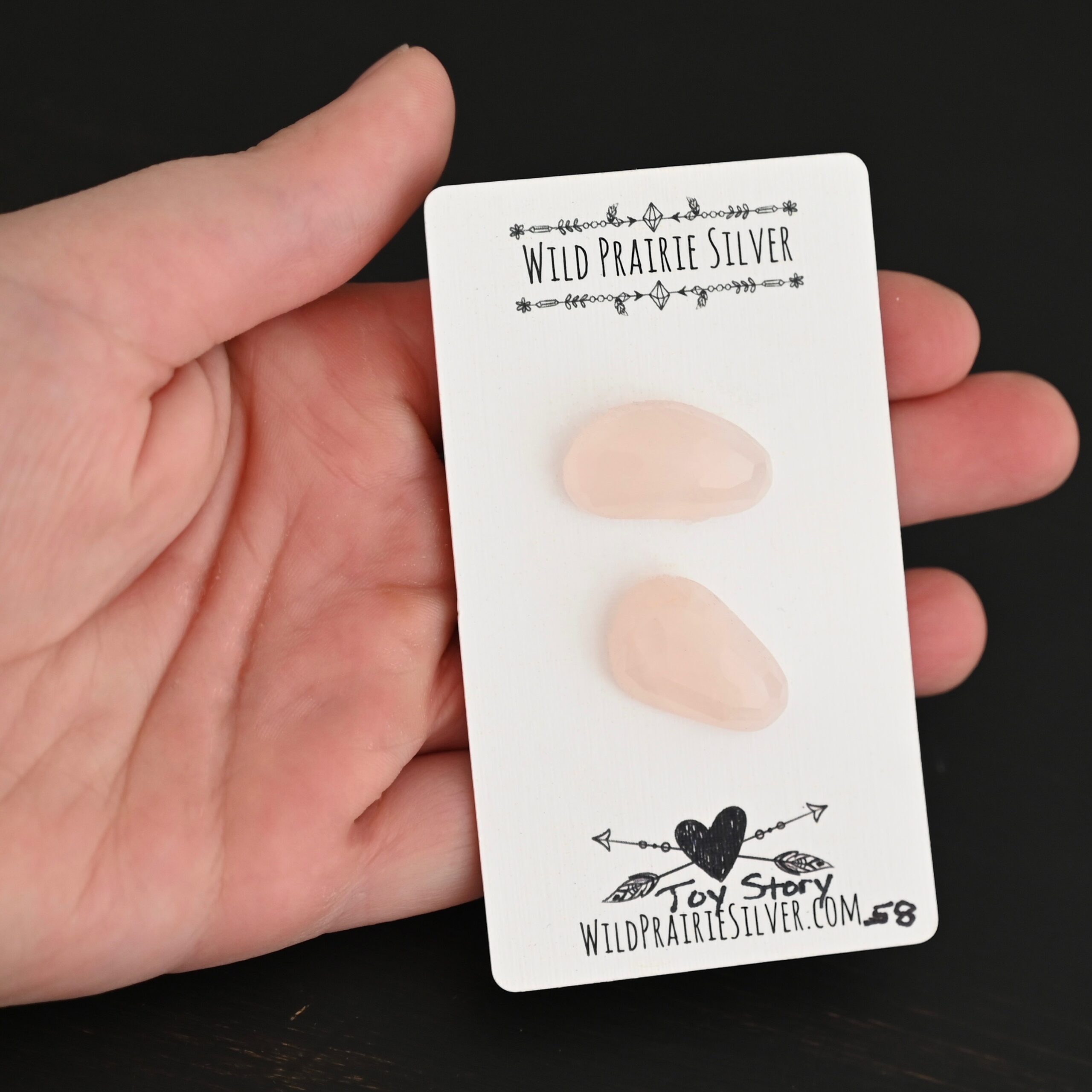 Toy Story Rose Cut Rose Quartz Cabochon Parcel shown in hand