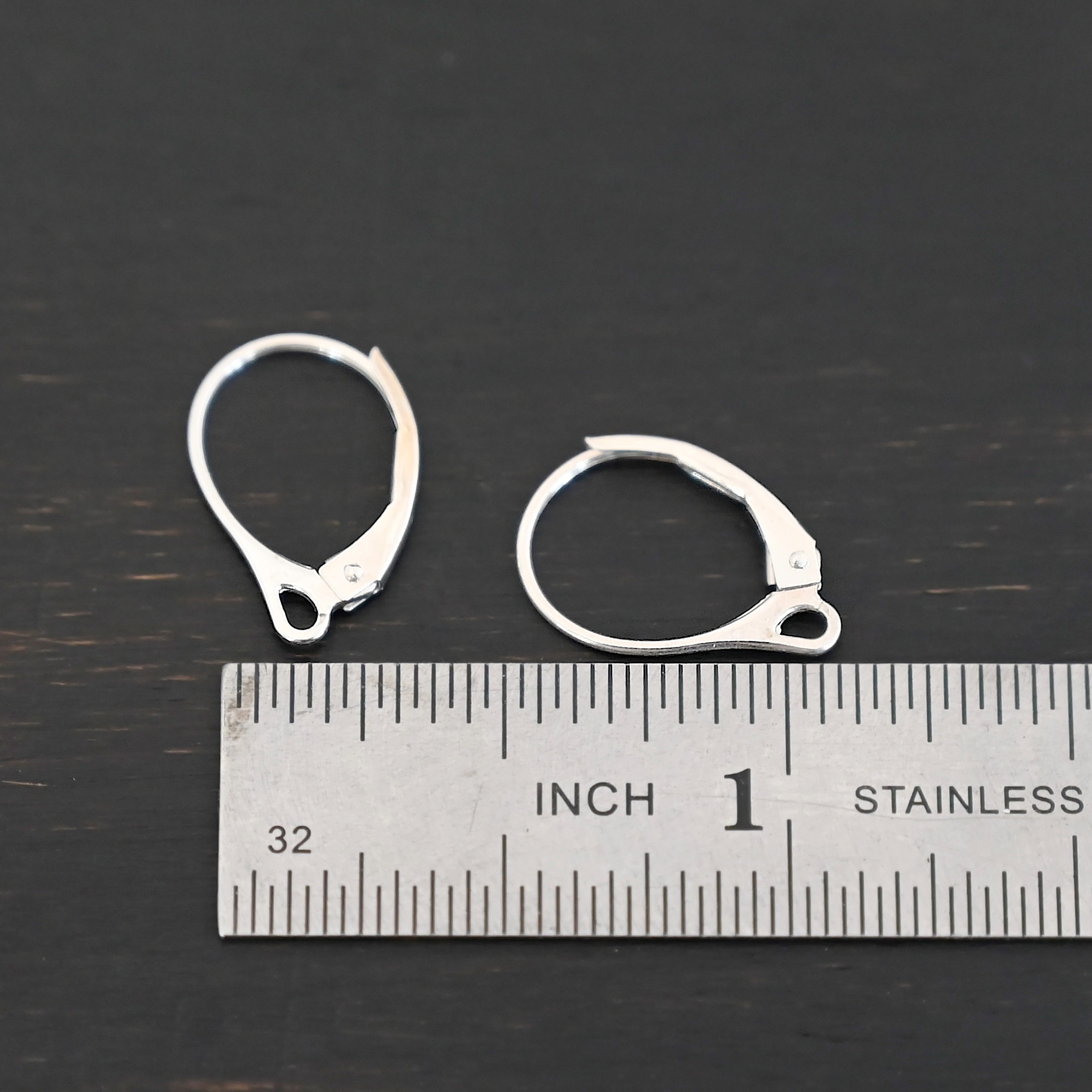Sterling Silver - Winter lever back ear wires shiny shown by ruler