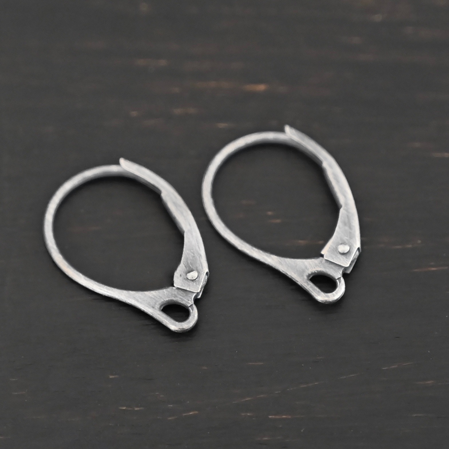 Sterling Silver - Winter lever back ear wires oxidized shown on dark background