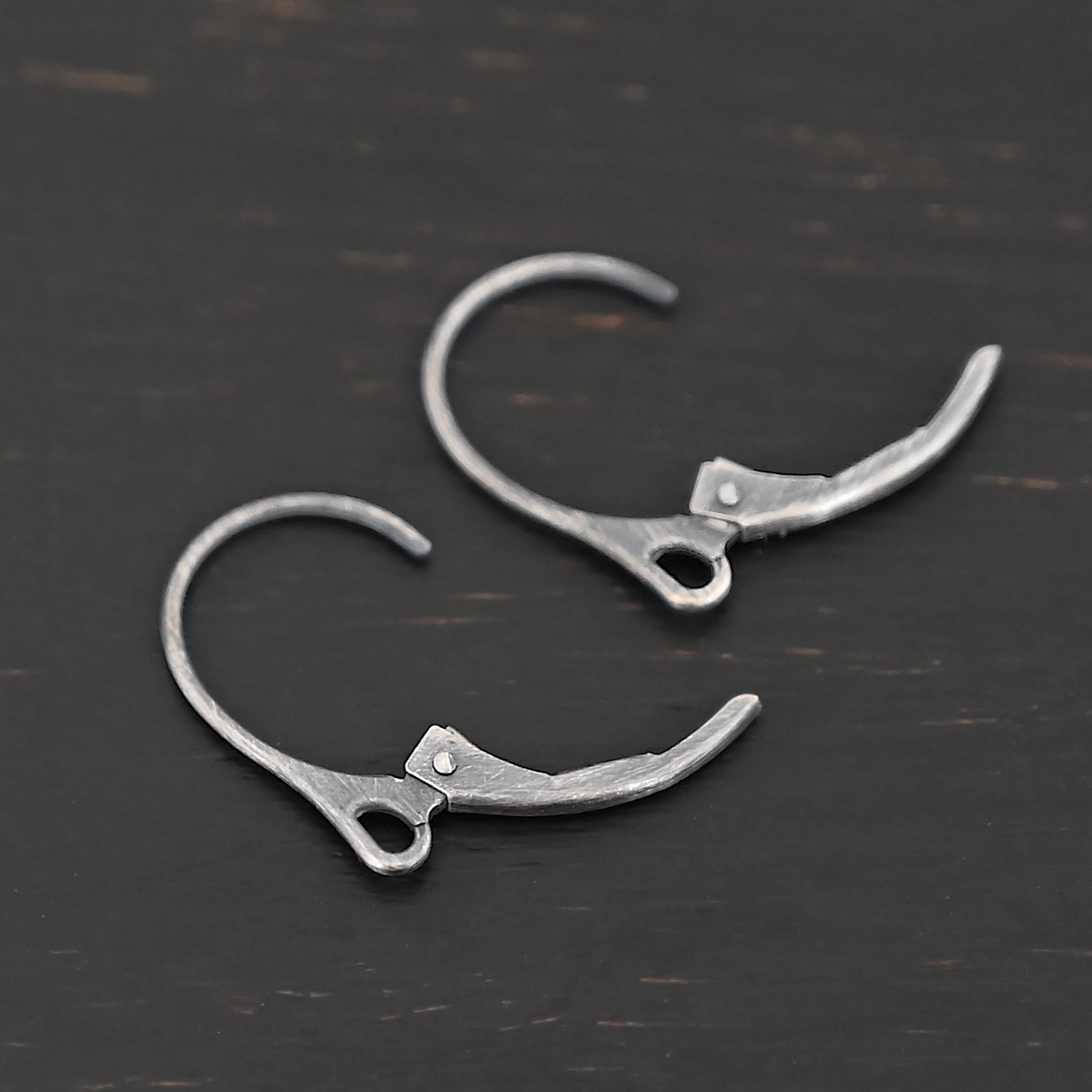 Sterling Silver - Winter lever back ear wires oxidized shown on dark background