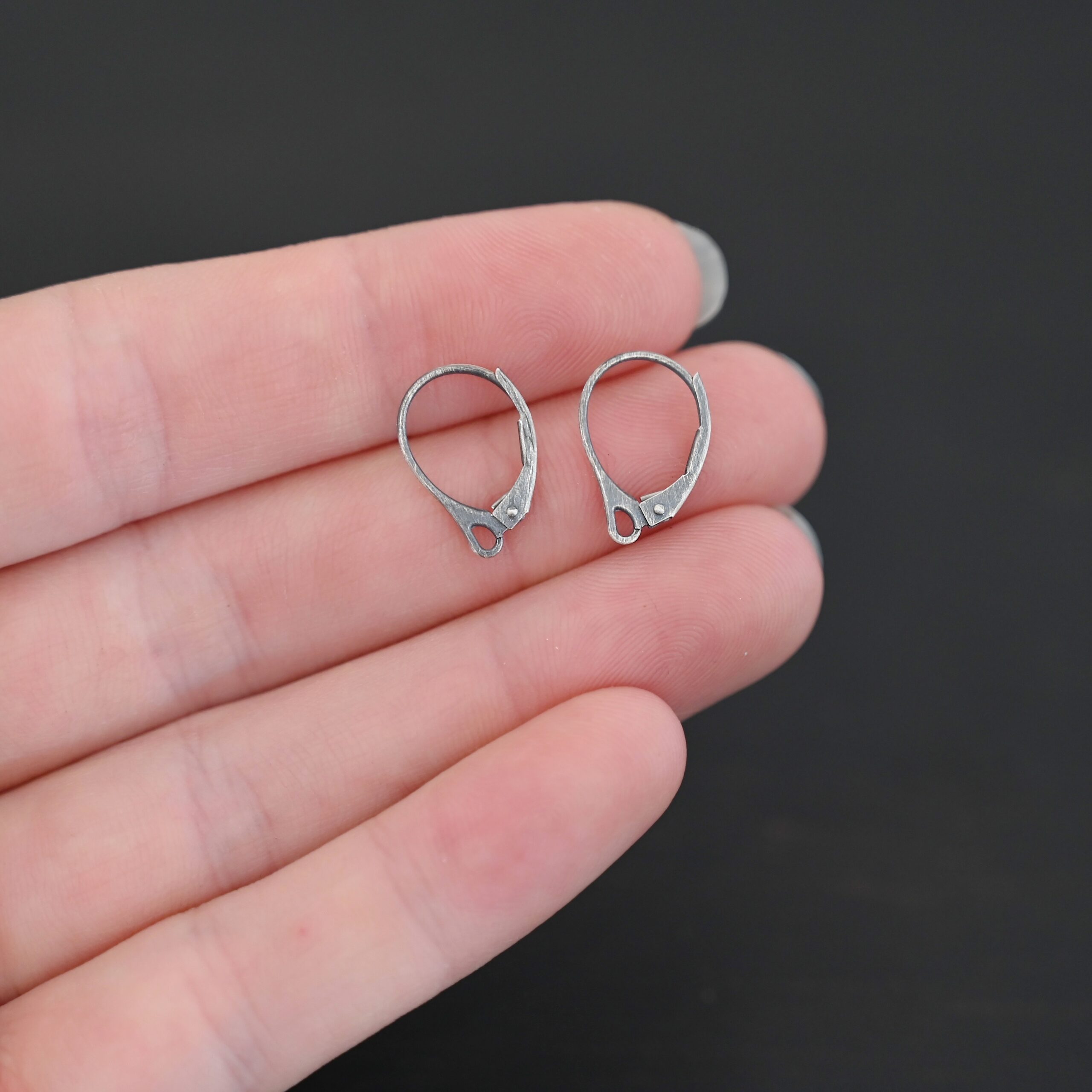 Sterling Silver - Winter lever back ear wires oxidized shown in hand