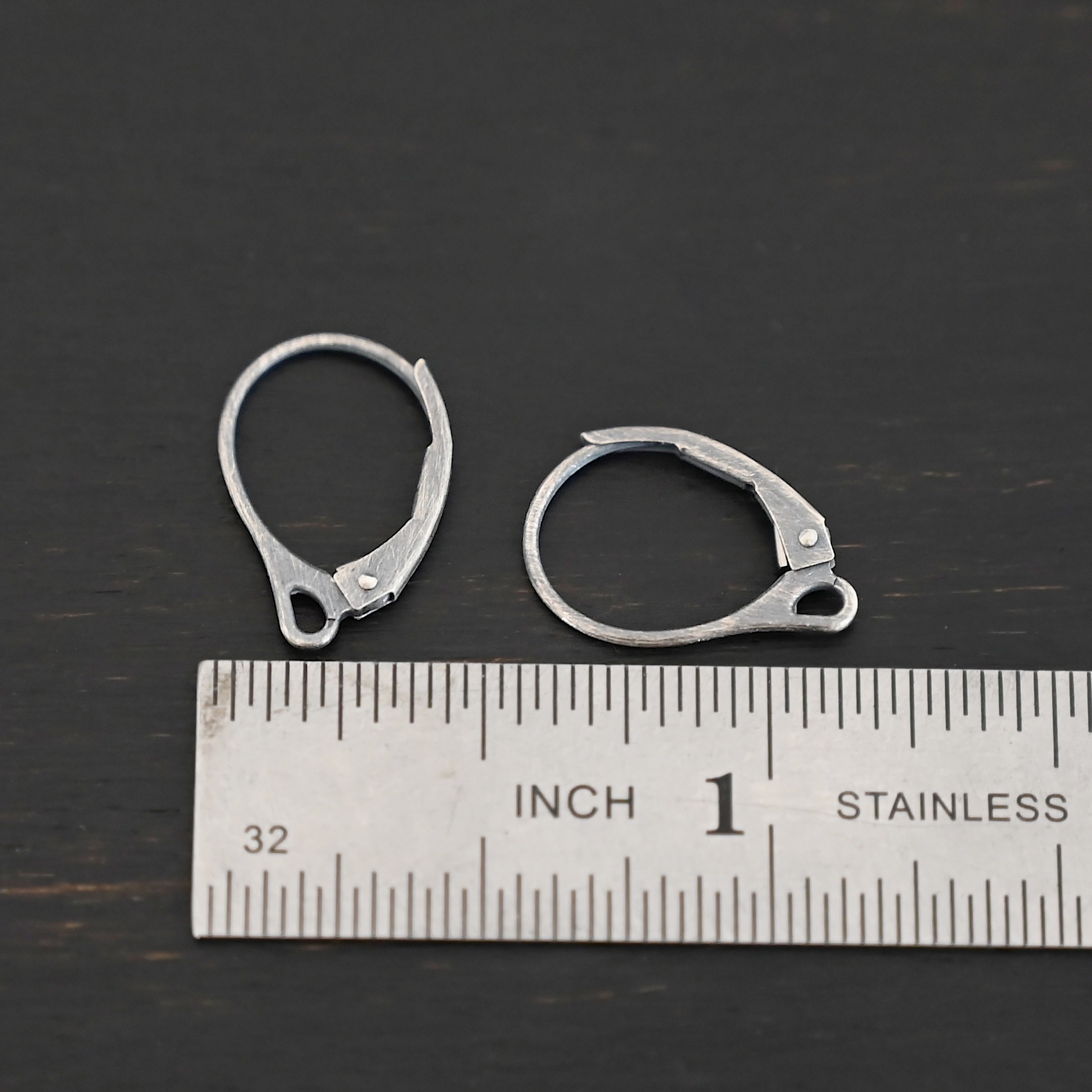 Sterling Silver - Winter lever back ear wires oxidized shown by ruler