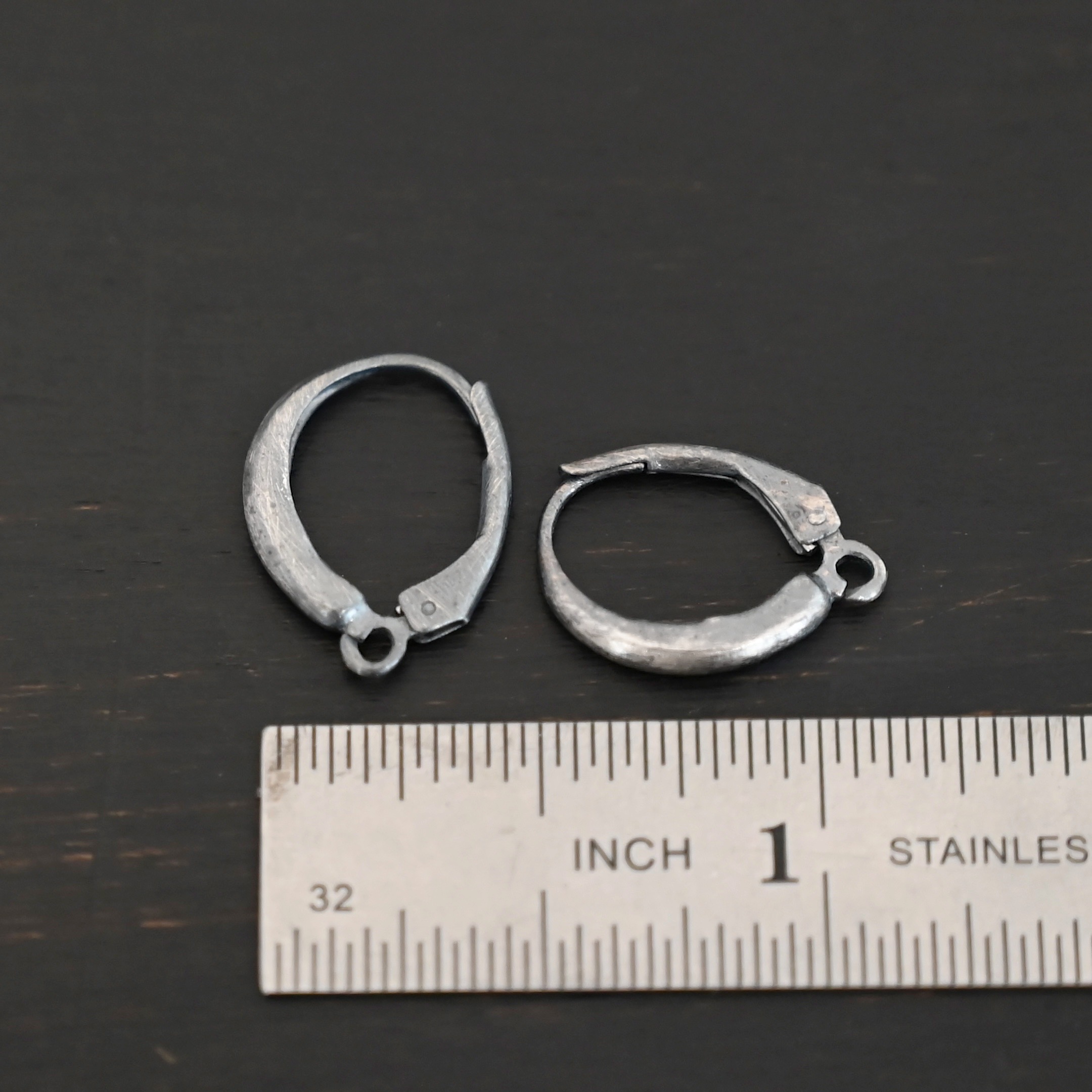 sterling silver Willa lever back ear wires - oxidized shown by ruler