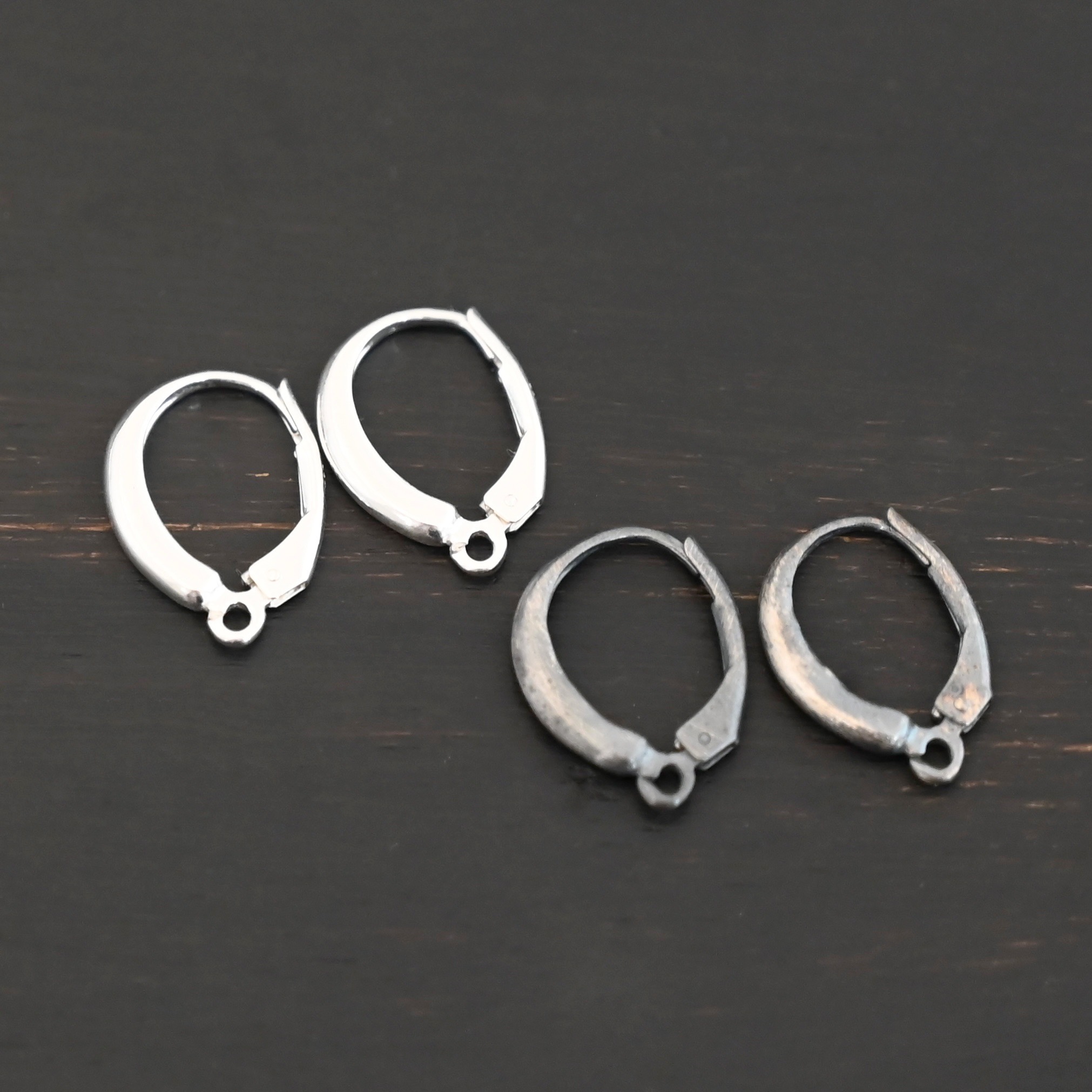 sterling silver Willa lever back ear wires - oxidized & shiny shown on dark background