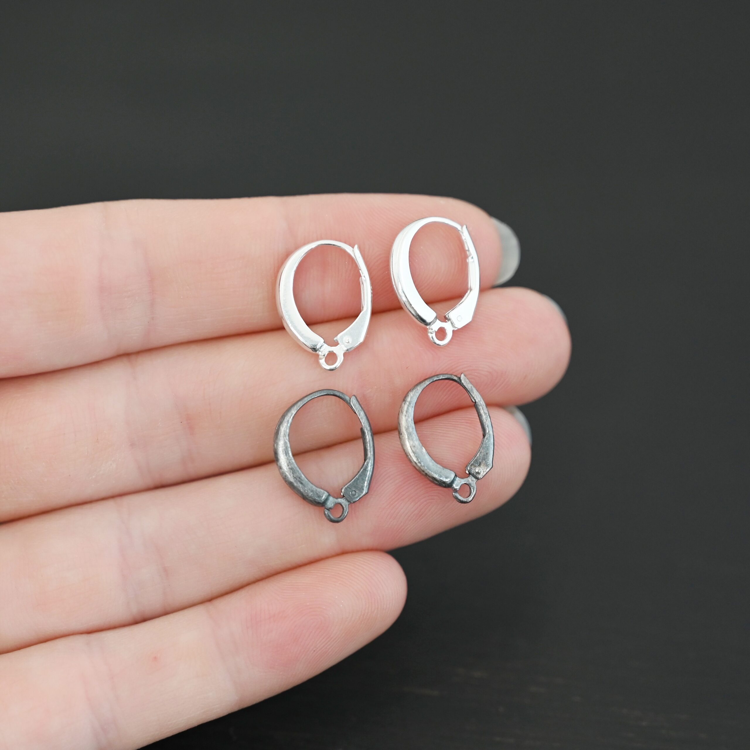 sterling silver Willa lever back ear wires - oxidized & shiny shown in hand