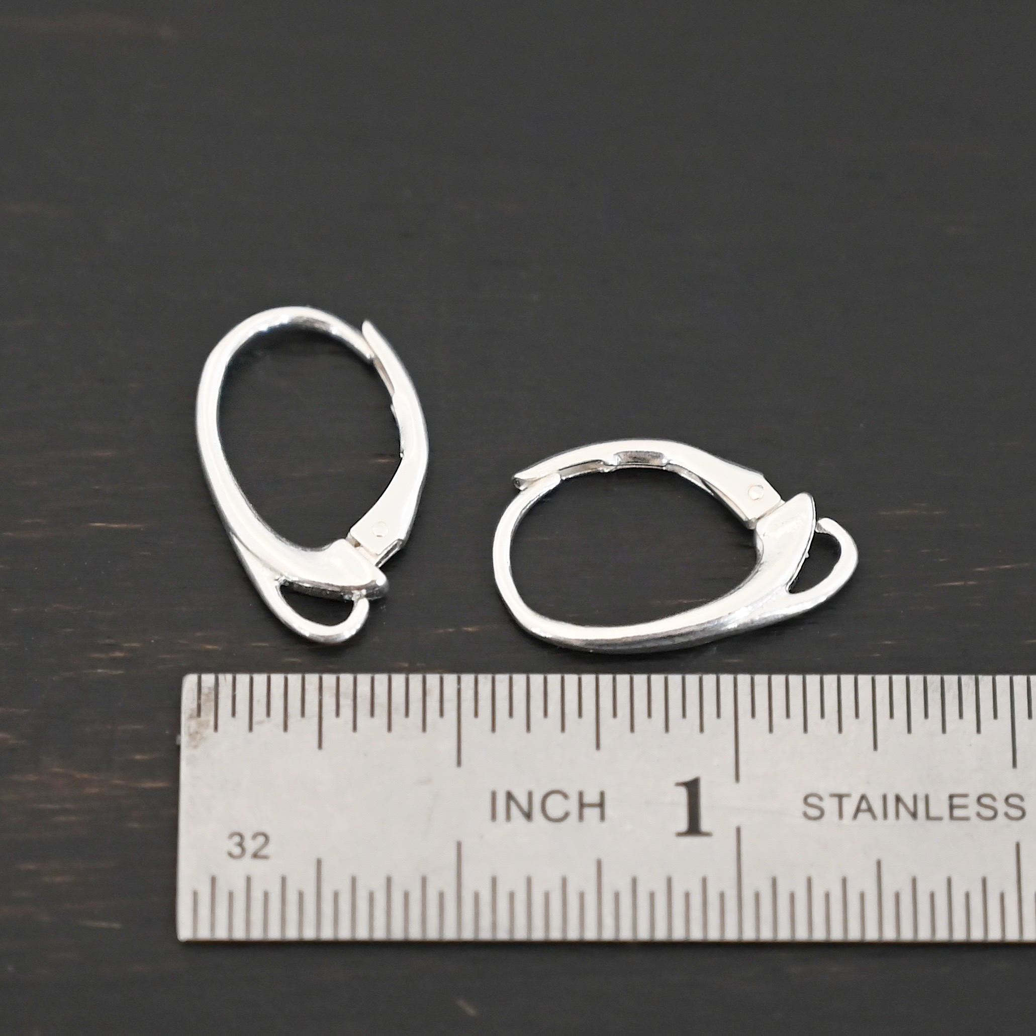 sterling silver Wendy lever back ear wires - shiny shown by ruler