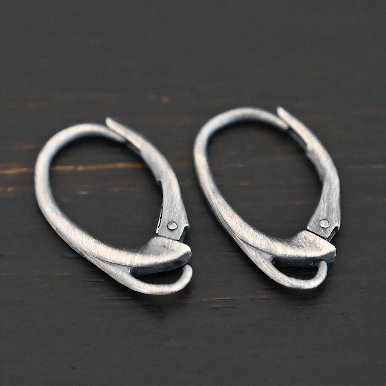 sterling silver Wendy lever back ear wires - oxidized shown on dark background