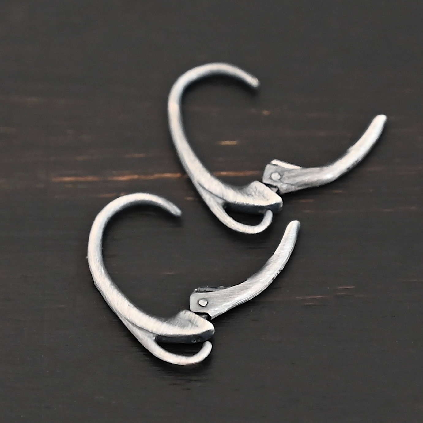 sterling silver Wendy lever back ear wires - oxidized shown on dark background