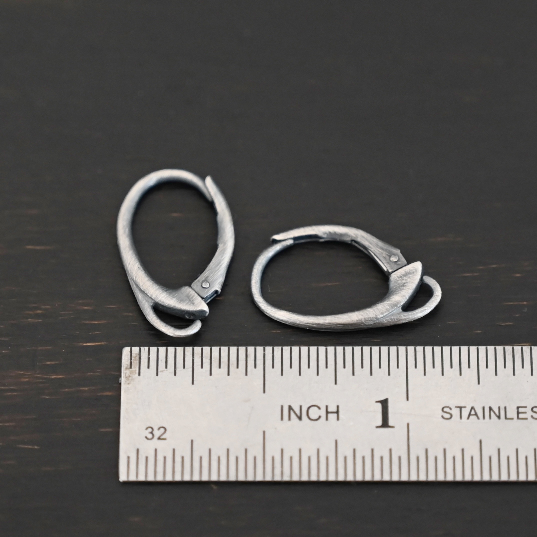 sterling silver Wendy lever back ear wires - oxidized shown by ruler