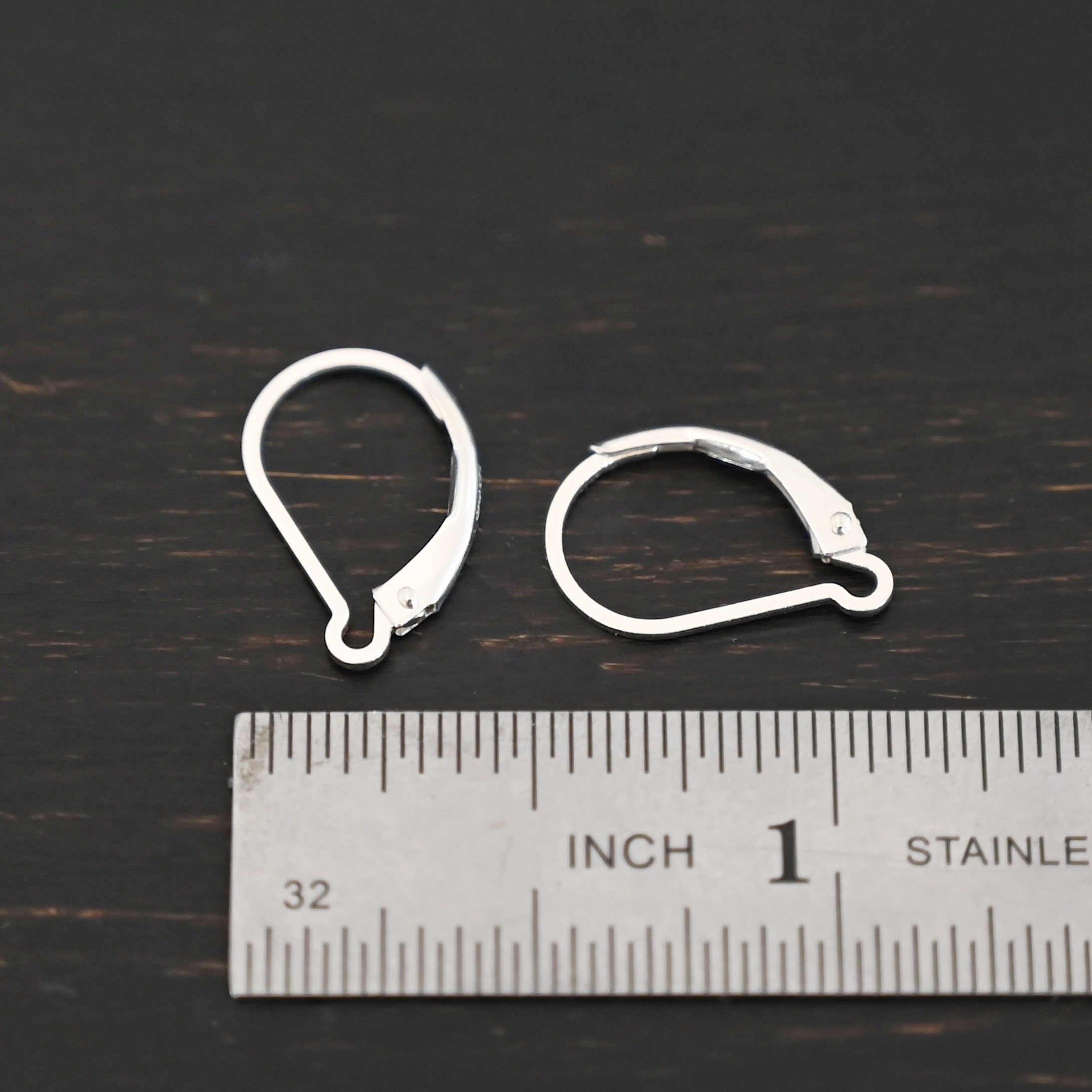 sterling silver Waverly lever back ear wires - shiny shown by ruler