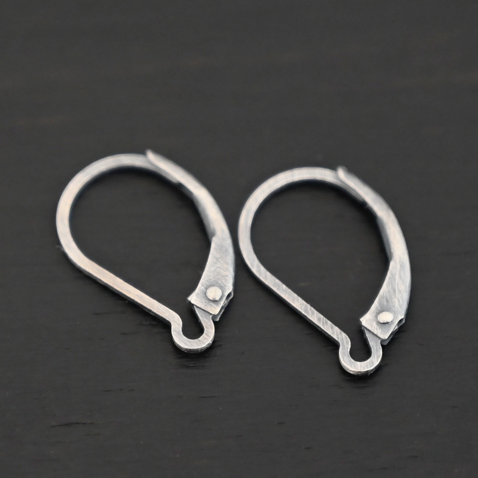 sterling silver Waverly lever back ear wires - oxidized shown on dark background