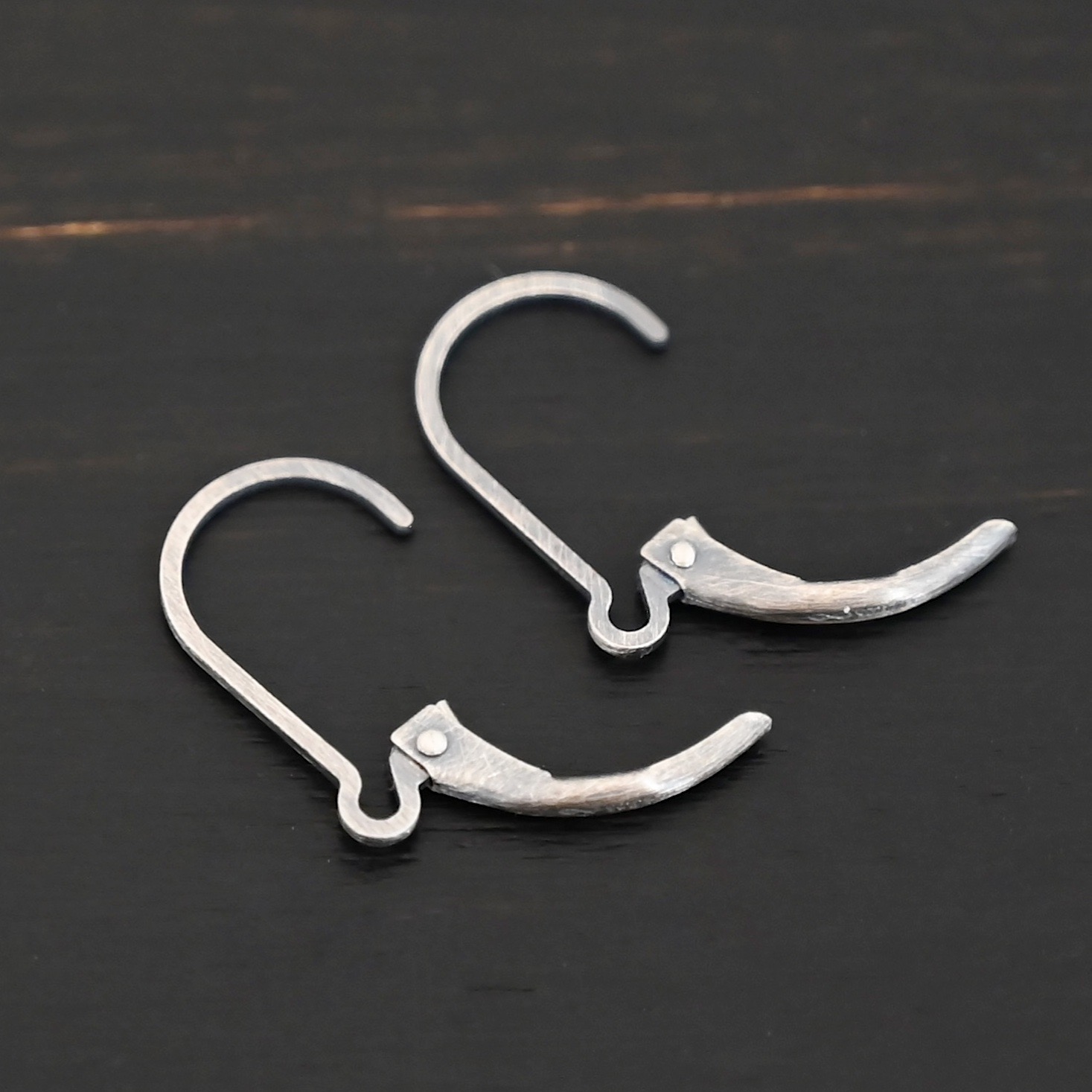sterling silver Waverly lever back ear wires - oxidized shown on dark background