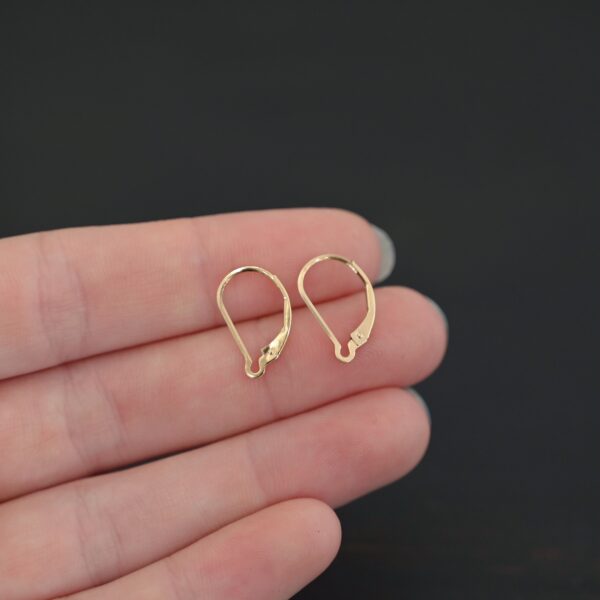 14k gold filled Waverly lever back ear wires shown in hand