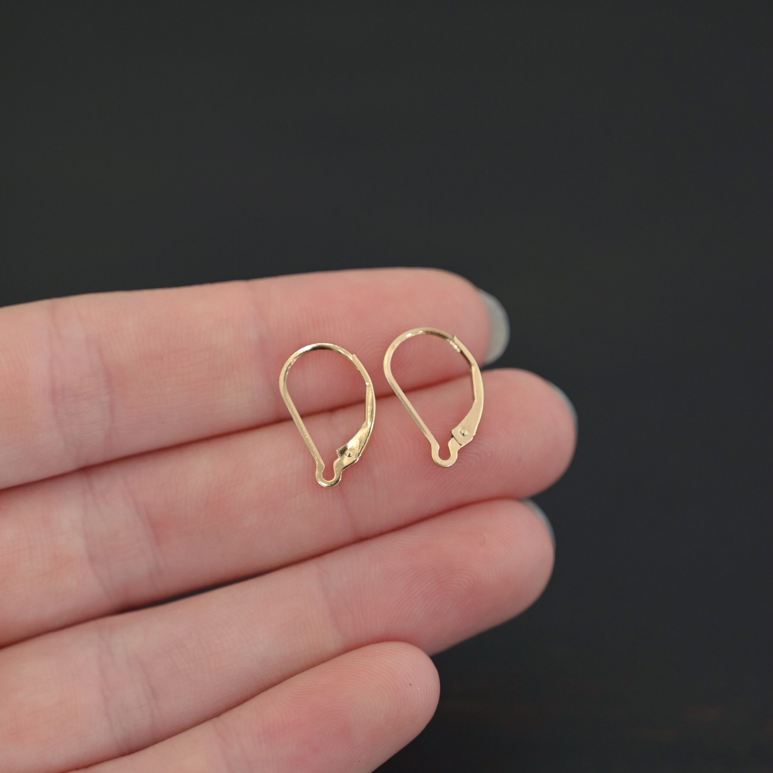 14k gold filled Waverly lever back ear wires shown in hand