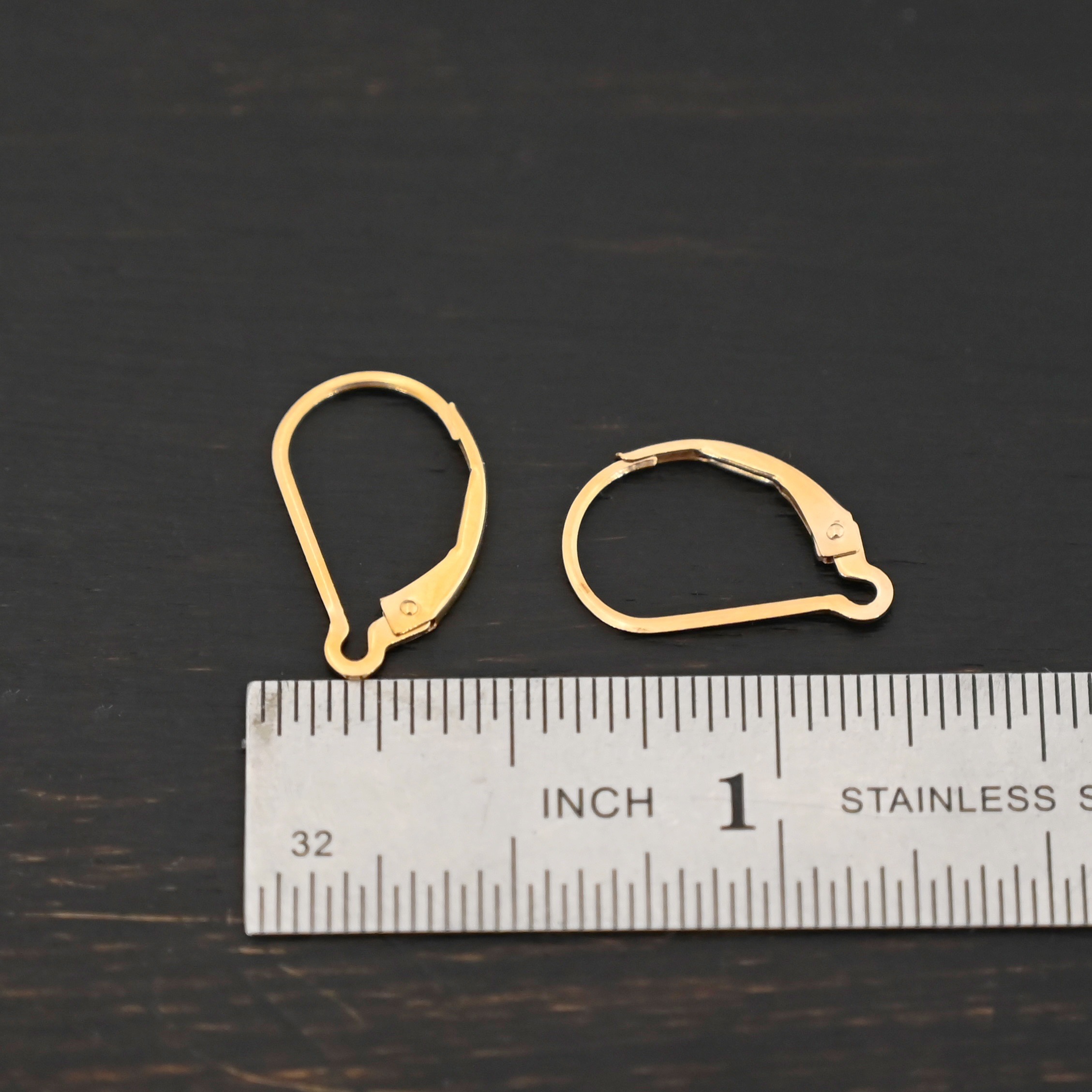 14k gold filled Waverly lever back ear wires shown by ruler