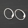 Sterling silver Wren lever back ear wires - shiny, shown on dark background
