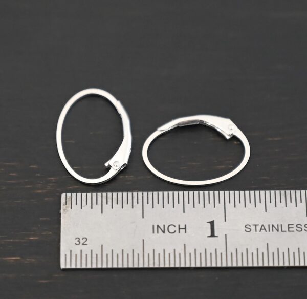 Sterling silver Wren lever back ear wires - shiny, shown by ruler