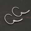 Sterling silver Wren lever back ear wires - oxidized, shown on dark background