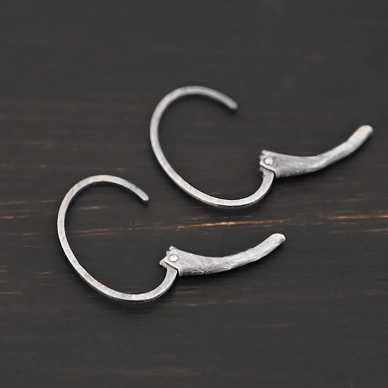 Wren leverback ear wires - oxidized Sterling silver Wren lever back ear wires - oxidized, shown on dark background