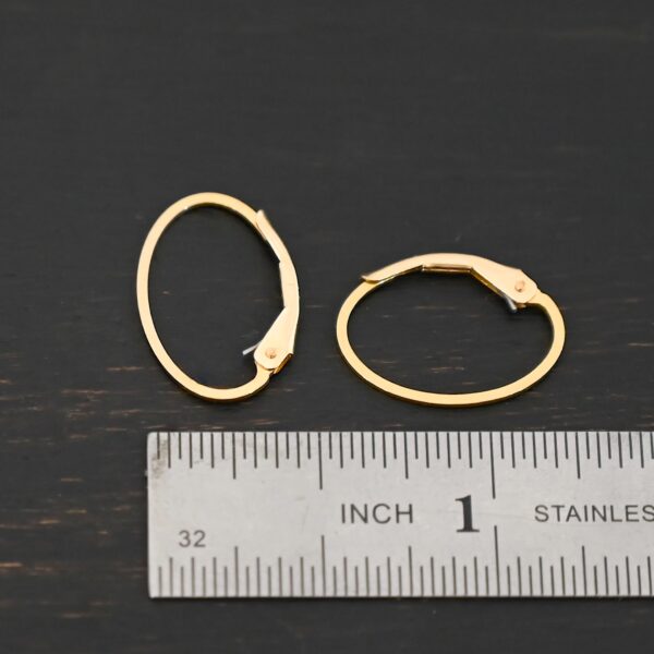 14k gold filled Wren lever back ear wires shown by ruler