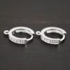 Rhodium Plated Sterling Silver Wisdom CZ Huggie Hoops shown on dark background