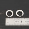 sterling silver Winona Huggie Hoop Earrings - shiny shown by ruler