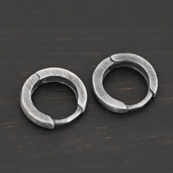 sterling silver Winona Huggie Hoop Earrings - oxidized shown on dark background
