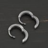 sterling silver Winona Huggie Hoop Earrings - oxidized shown on dark background