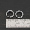 sterling silver Winona Huggie Hoop Earrings - oxidized shown by ruler