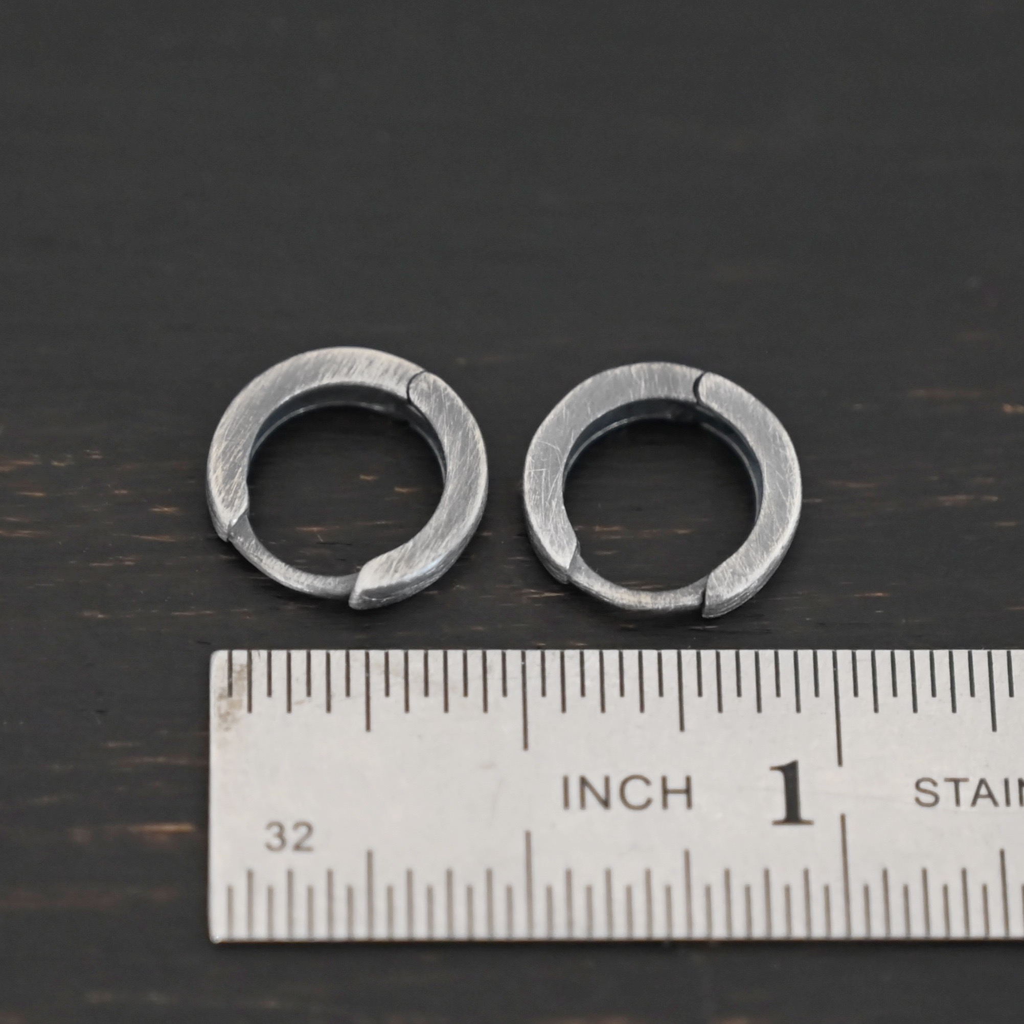 sterling silver Winona Huggie Hoop Earrings - oxidized sterling silver Winona Huggie Hoop Earrings - oxidized shown by ruler