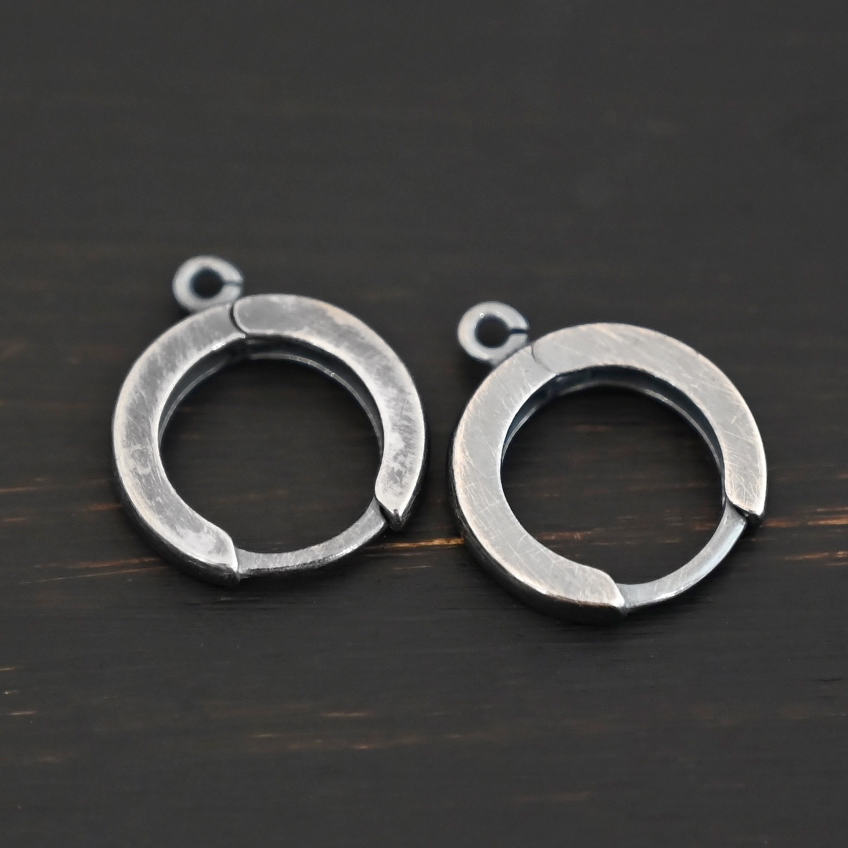 Sterling sIlver Winifred Huggie Hoops - oxidized shown on dark background