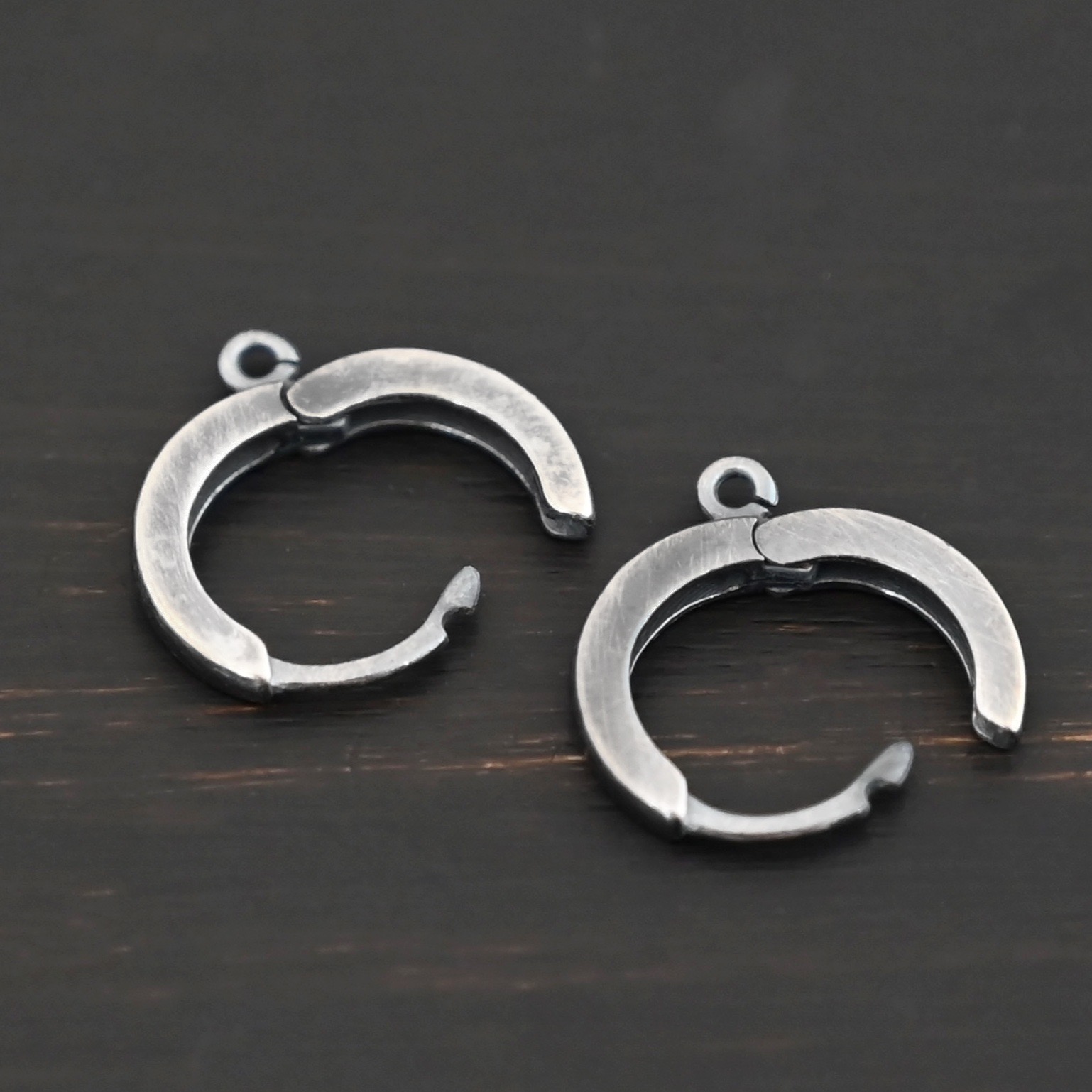 Sterling sIlver Winifred Huggie Hoops - oxidized shown on dark background