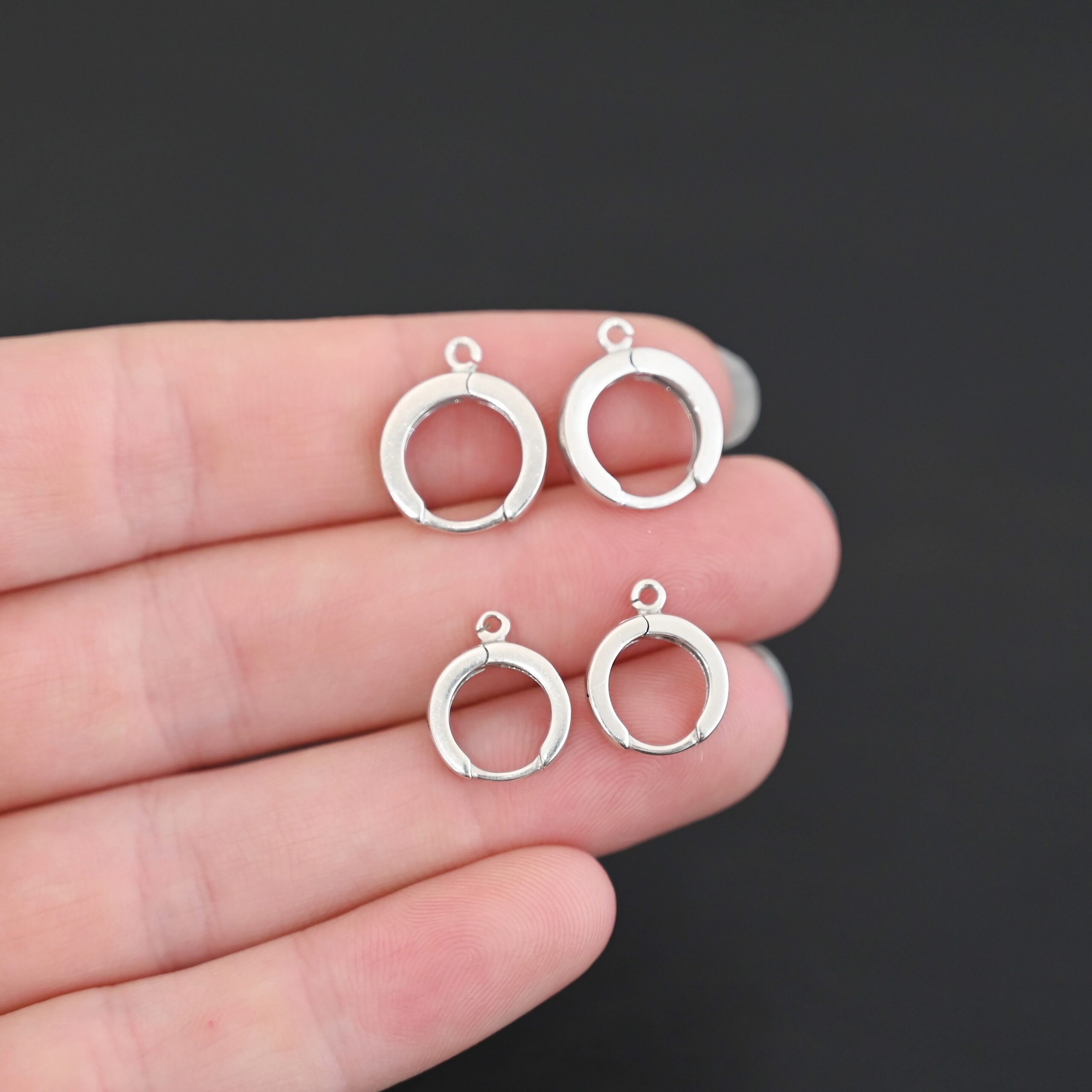 Sterling sIlver Winifred Huggie Hoops - shiny shown in hand