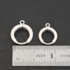 Sterling sIlver Winifred Huggie Hoops - shiny shown by ruler