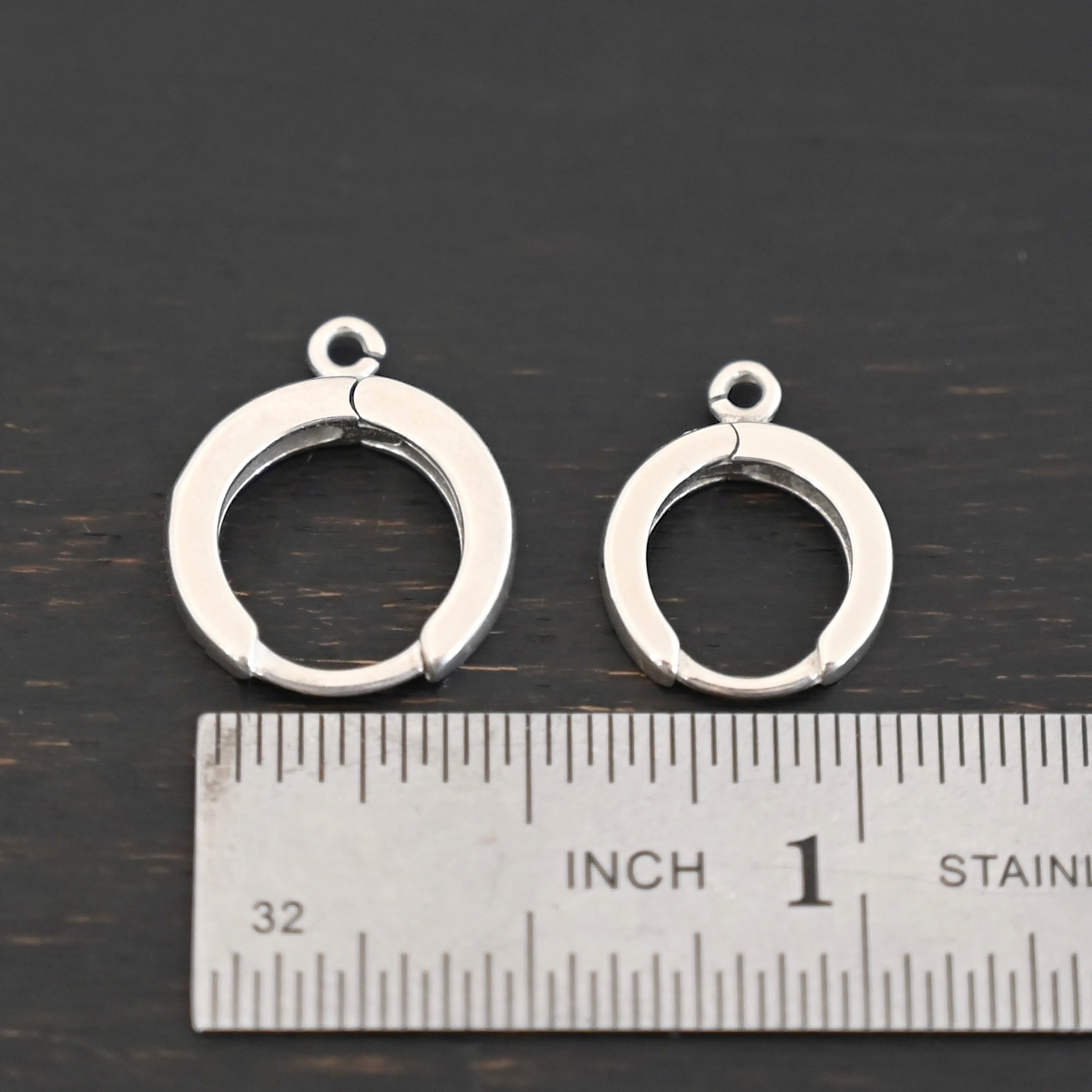 Sterling sIlver Winifred Huggie Hoops - shiny shown by ruler