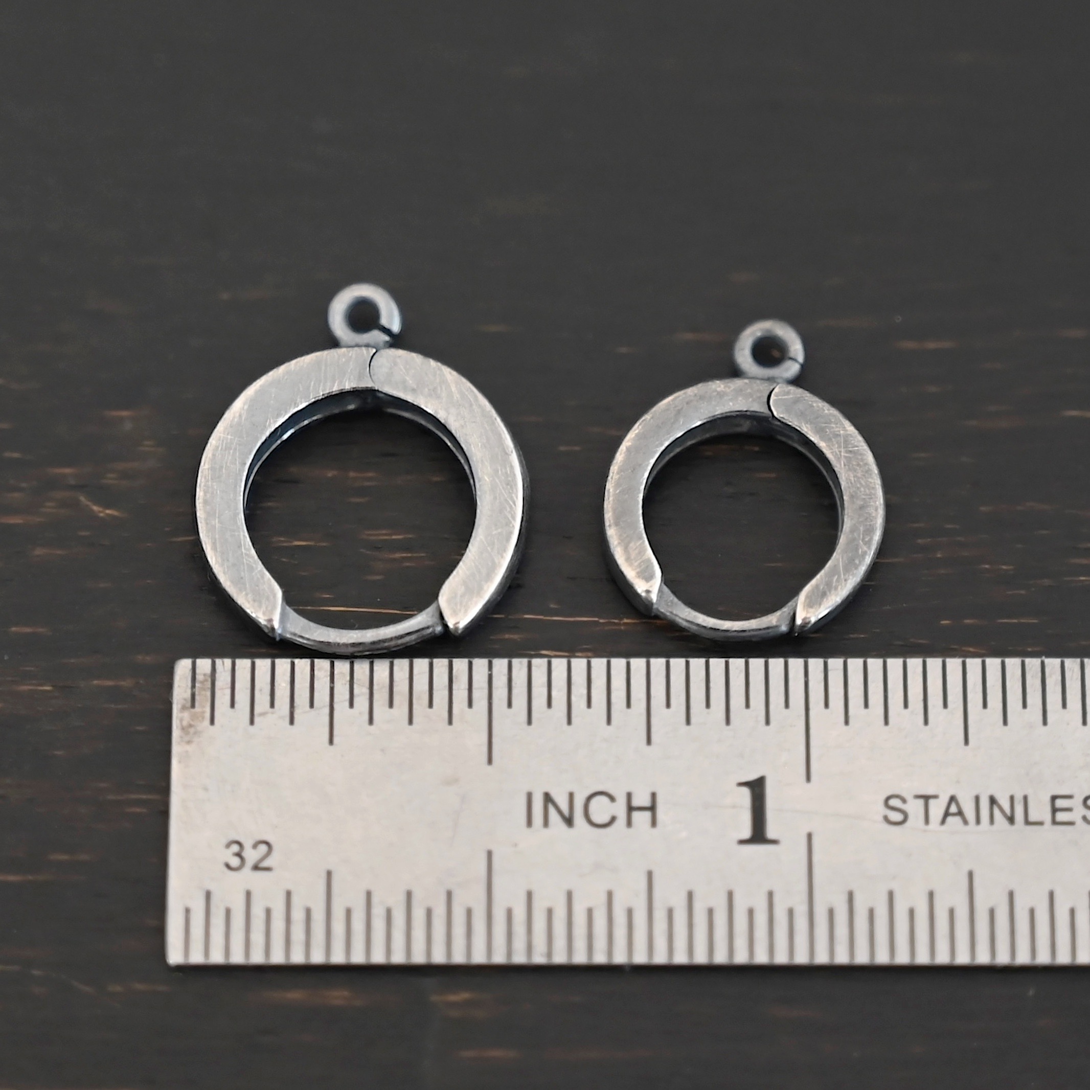 Sterling sIlver Winifred Huggie Hoops - oxidized shown by ruler