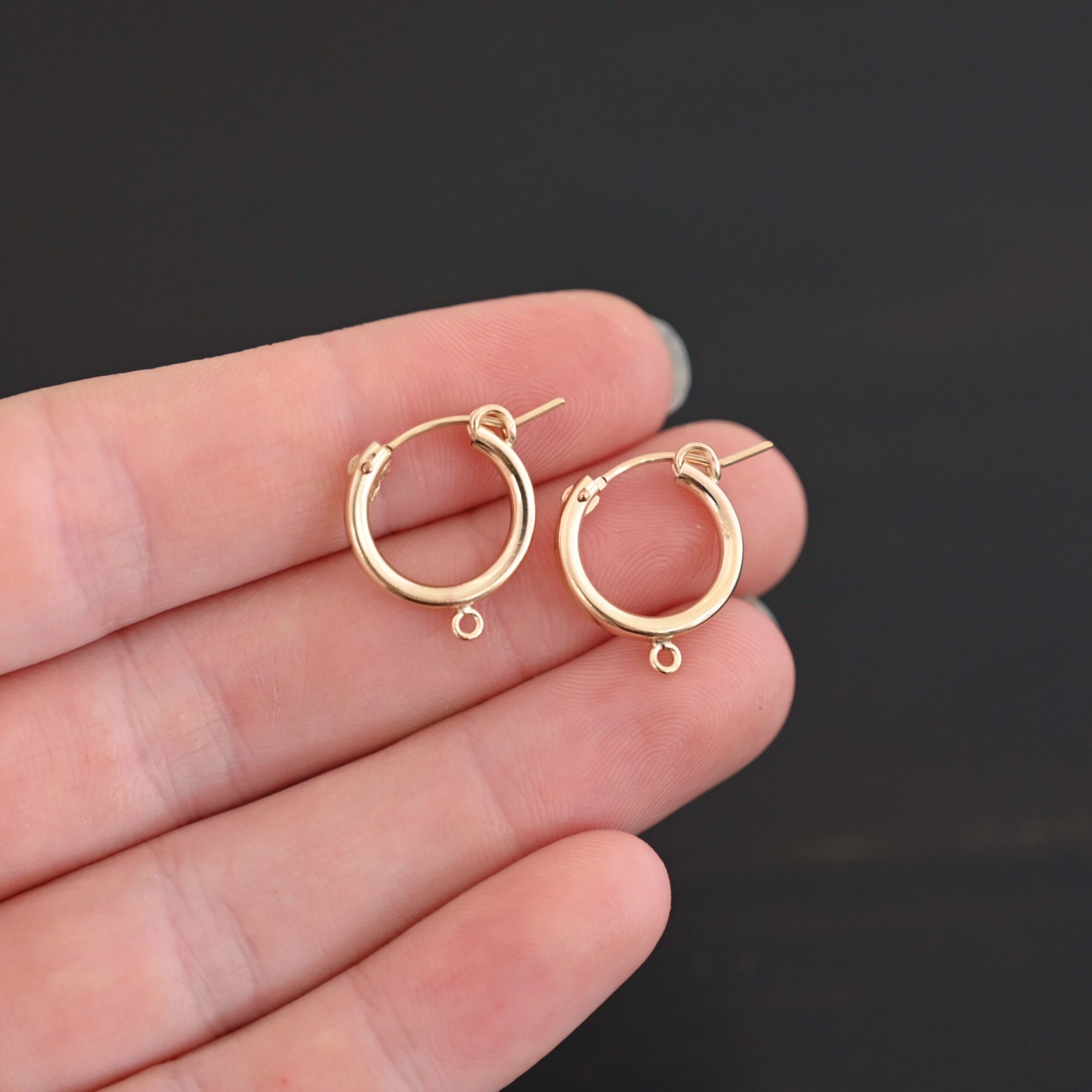 West 14k gold filled hoops shown in hand