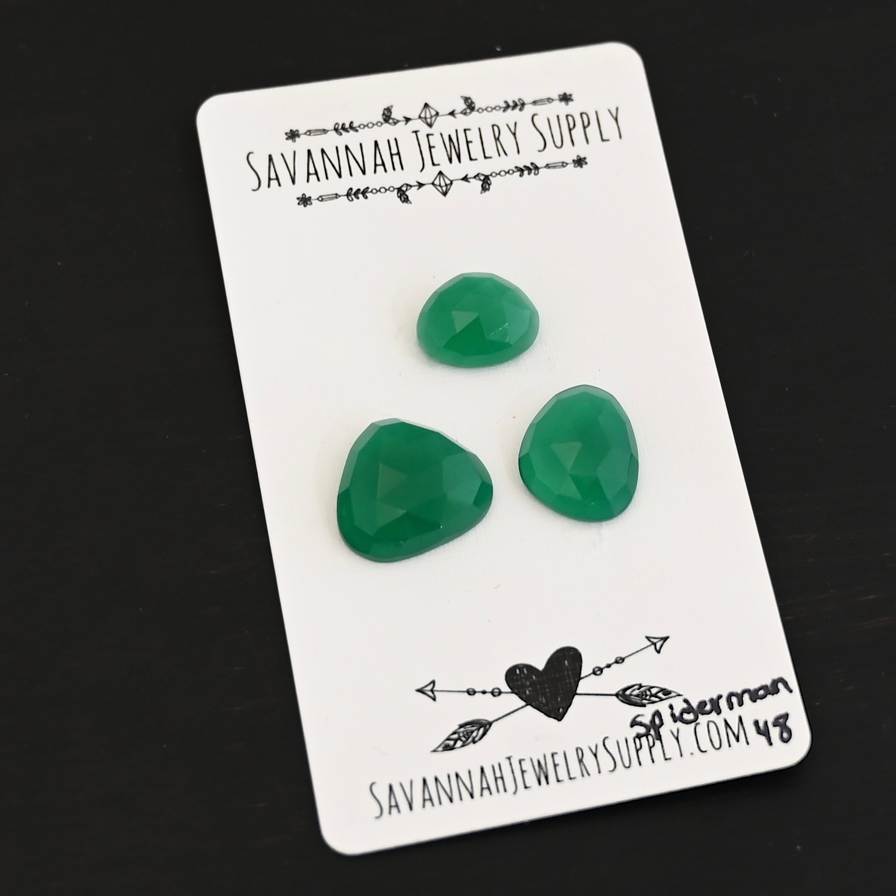 Spiderman Rose cut Green Onyx Cabochon Parcel shown on business card