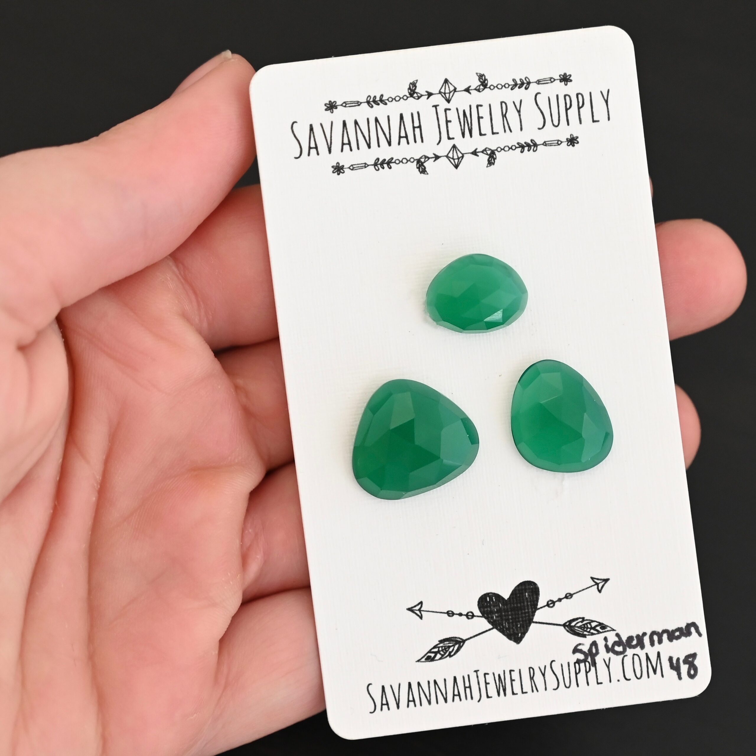 Spiderman Rose cut Green Onyx Cabochon Parcel shown in hand