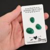 Superman Rose cut Green Onyx Cabochon Parcel shown in hand