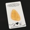 Banana Calcetite Cabochon shown on business card