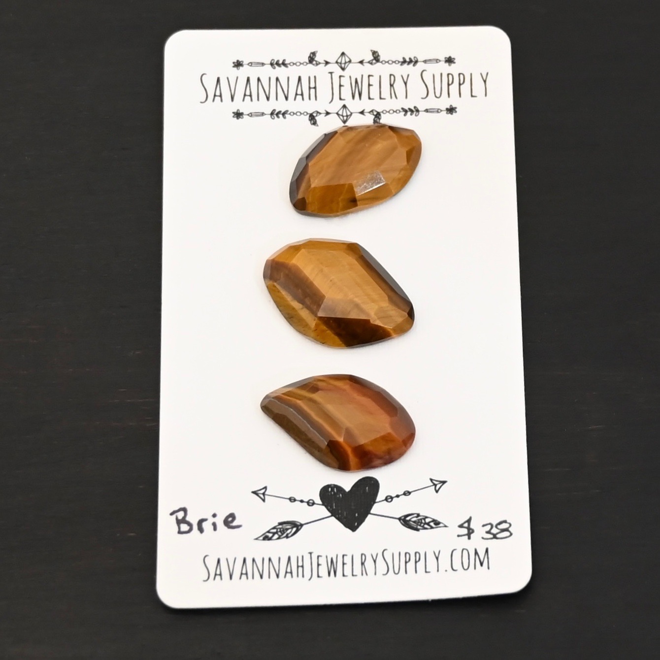Brie Rosecut Tiger Eye Cabochon Parcel shown on business card