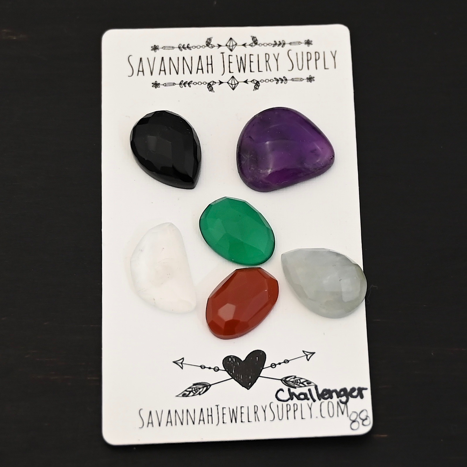 Challenger Rainbow Cabochon Parcel shown on business card