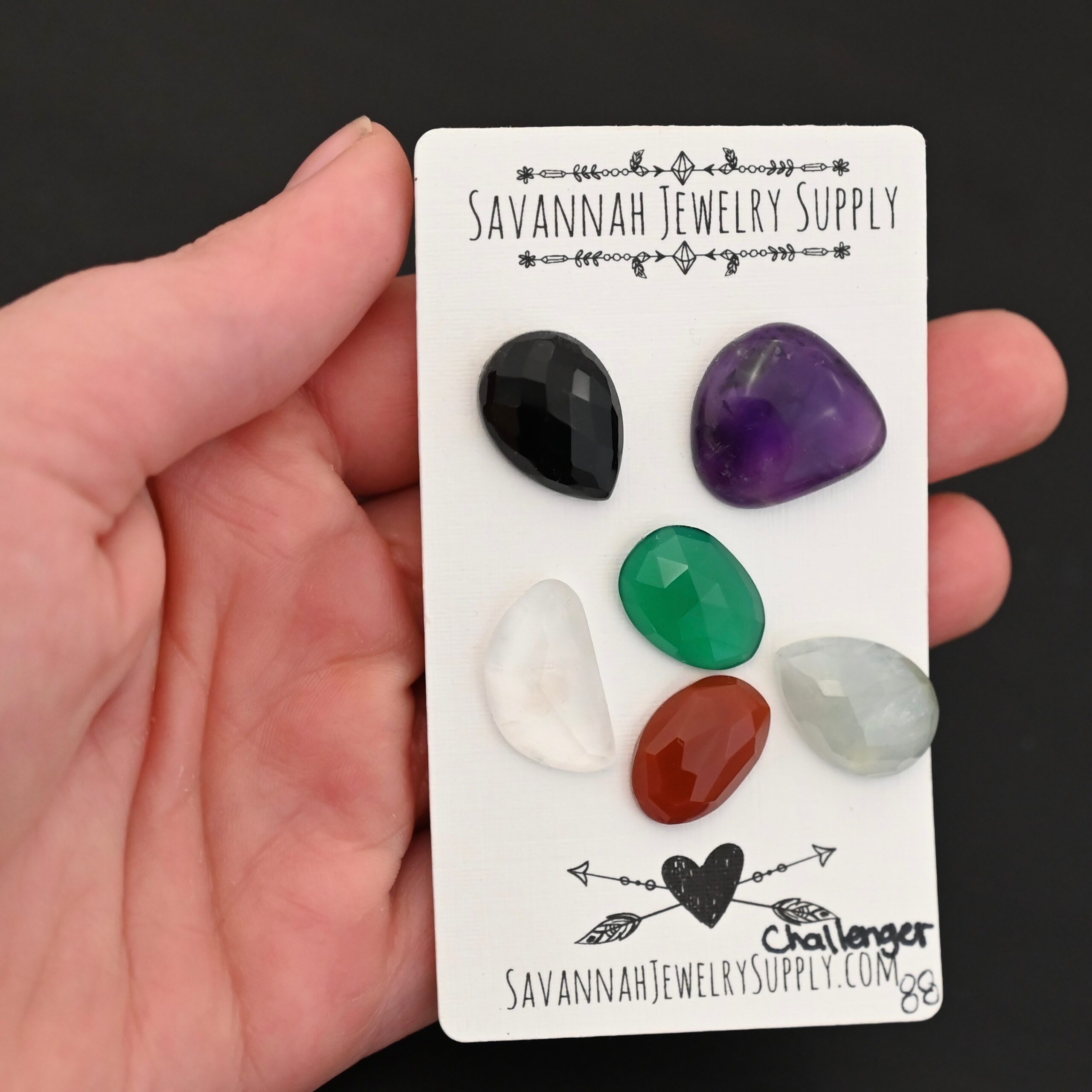 Challenger Rainbow Cabochon Parcel shown in hand